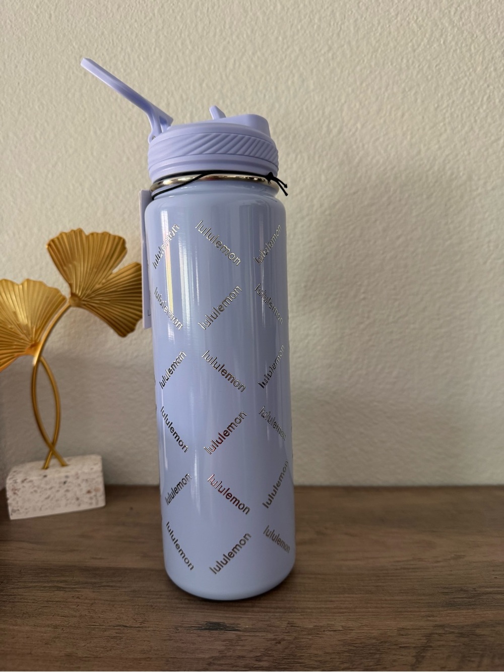 lululemon light lavender stainless water bottle with straw lid and logo pattern